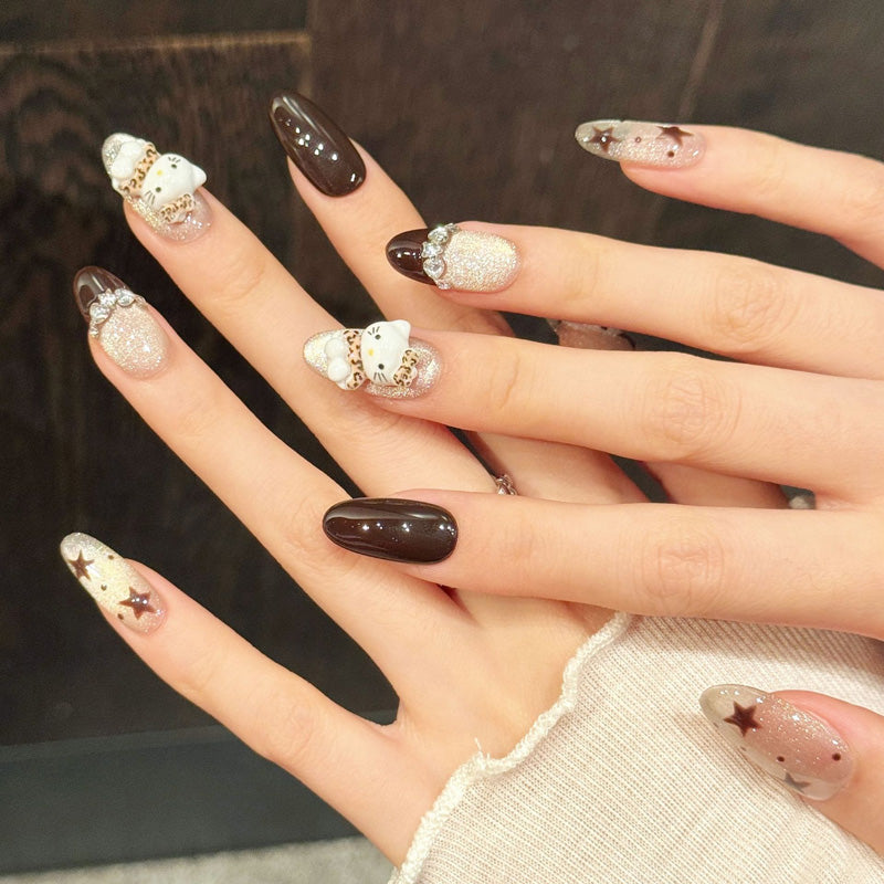 Kawaii oval nails with Hello Kitty, stars, silver glitter & black gloss - perfect for Hello Kitty star glitter black silver kawaii playful charm
