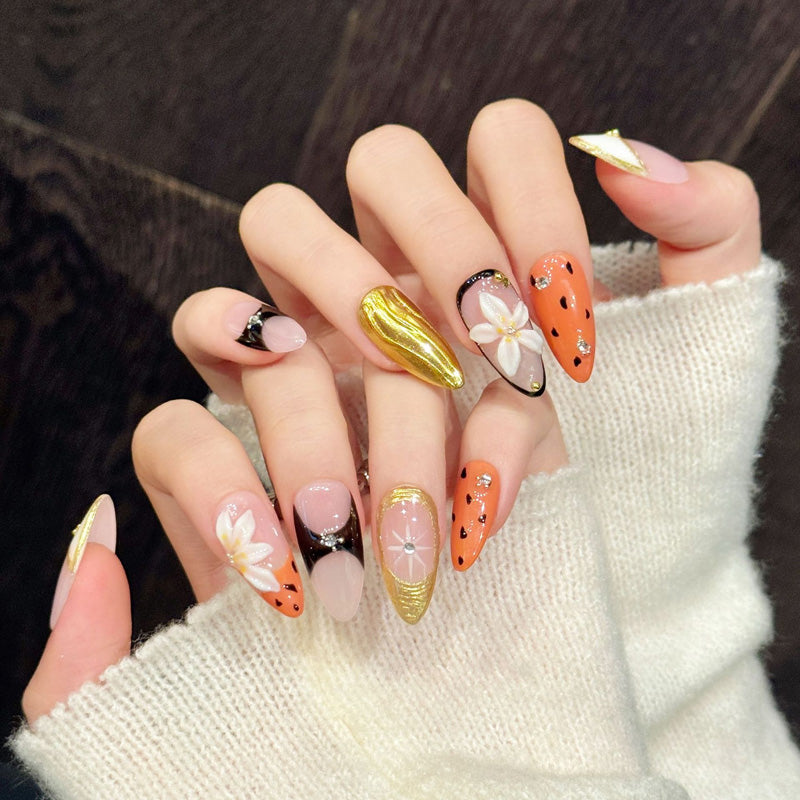 Luxurious almond nails with 3D flower, gold chrome, orange leopard & crystals - perfect for gold flower orange leopard crystal glamorous charm style