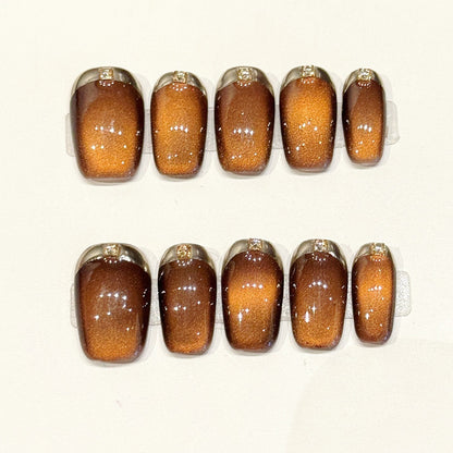Luxurious coffin press-ons with amber gradient, crystallized sugar texture & gold French tips - handcrafted tactile nail art