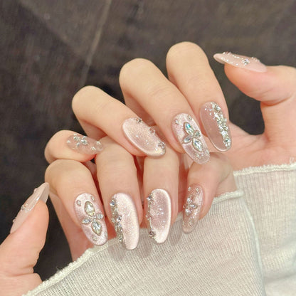 Luxurious oval nails with crystal diamonds, silver shimmer, rhinestone borders & pink gradient - perfect for luxury crystal diamond shimmer elegance