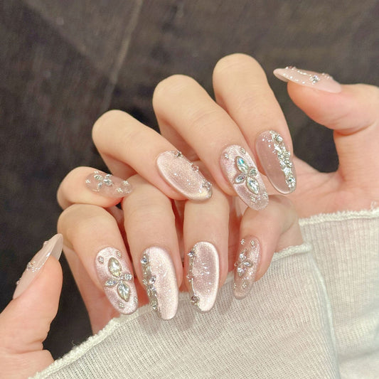 Luxurious oval nails with crystal diamonds, silver shimmer, rhinestone borders & pink gradient - perfect for luxury crystal diamond shimmer elegance
