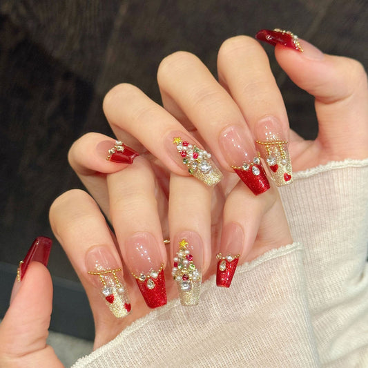 Luxurious press-on nails with 3D Christmas tree, red glitter, gold shimmer & crystal chains - perfect for glamorous Christmas tree celebrations