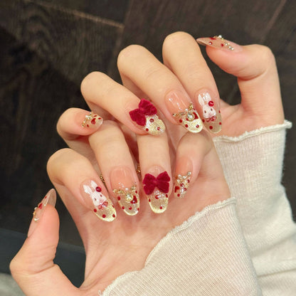 Luxurious press-on nails with 3D velvet bow, gold glitter, ruby gems & pearls - perfect for romantic velvet bow luxury elegance & sophisticated style
