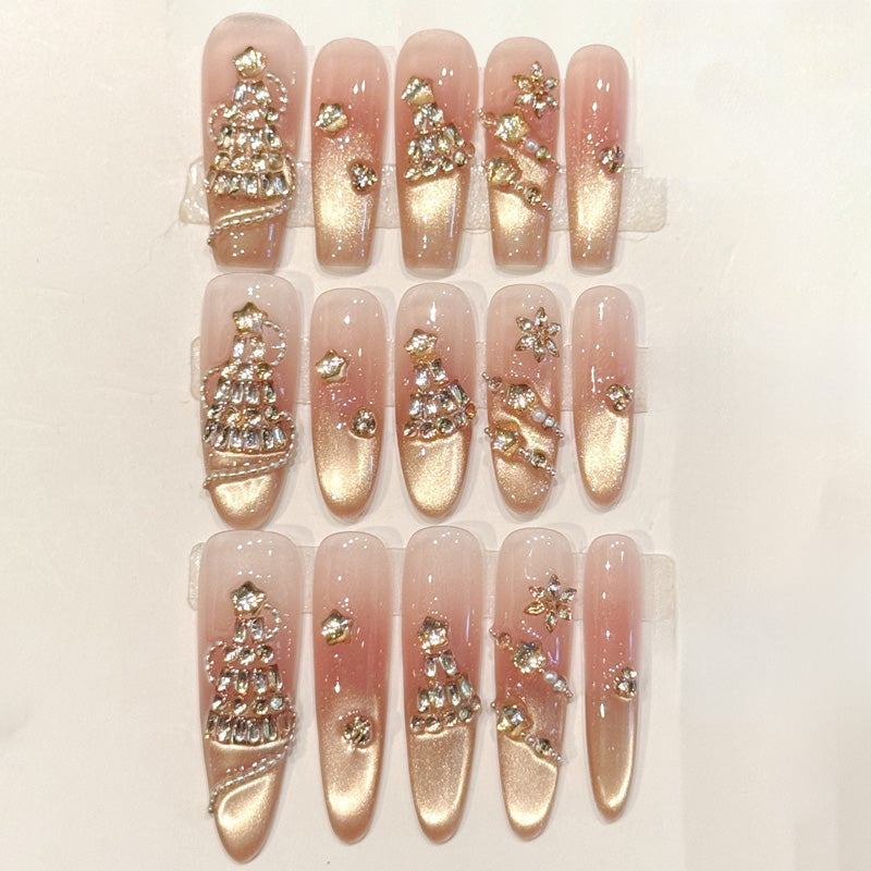 Luxurious press-ons with rose gold gradient, rhinestone-encrusted Christmas trees & shimmer accents - handcrafted holiday elegance