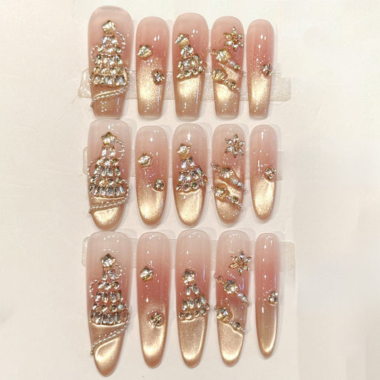 Luxurious press-ons with rose gold gradient, rhinestone-encrusted Christmas trees & shimmer accents - handcrafted holiday elegance
