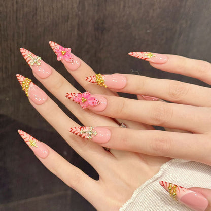 Luxurious stiletto nails with 3D pink flower, crystal cross, gold beads & red chevron - perfect for pink flower cross gold bead luxury glamorous charm