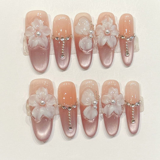 Luxury handmade oval nails with rose gold chrome & floral rhinestones - Reusable, salon-quality - Applies in 15 minutes