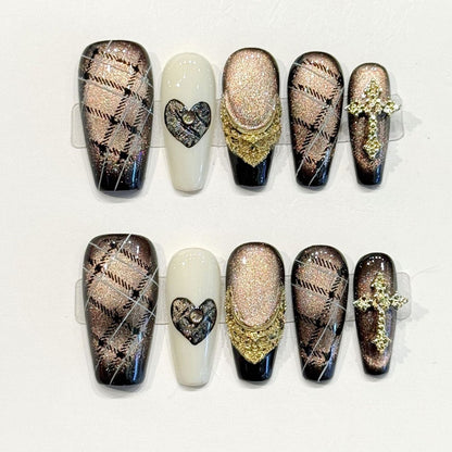 Opulent coffin press-ons with champagne shimmer, textured chevron patterns, rhinestone heart & gold cross - handcrafted luxury