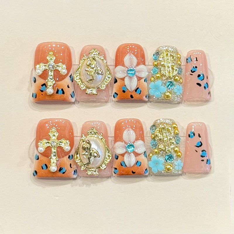 Opulent duck press-on nails with gold cross, baroque frame, pearl flowers & leopard print - perfect for baroque luxury statements & bold style