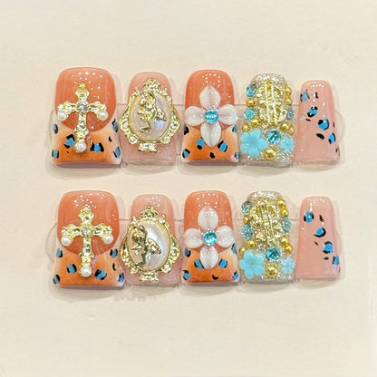 Opulent duck press-on nails with gold cross, baroque frame, pearl flowers & leopard print - perfect for baroque luxury statements & bold style