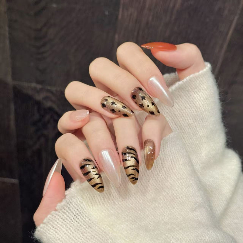 Premium almond nails for bold elegance - chic animal prints, luxurious pearl shimmer, vibrant orange, perfect for fashion celebrations
