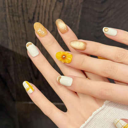 Premium almond nails for cheerful elegance - 3D yellow flower, yellow plaid pattern, adorable hearts, gold shimmer, perfect for spring celebrations