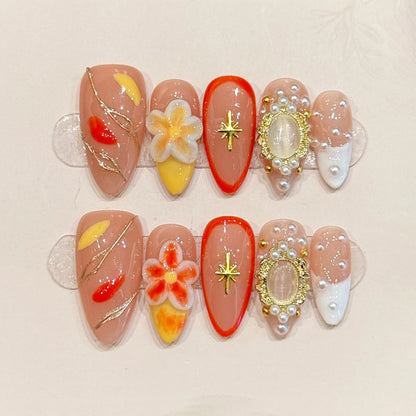 Premium almond nails for elegant luxury - 3D white-orange flowers, sparkling gold star, pearl frame, vibrant red, gold lines, perfect for glamorous celebrations
