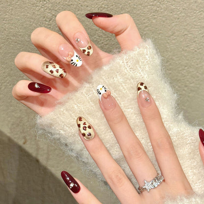 Premium almond nails for kawaii fun - 3D kitty character, playful leopard print, luxurious burgundy, sparkling crystals, perfect for cute celebrations