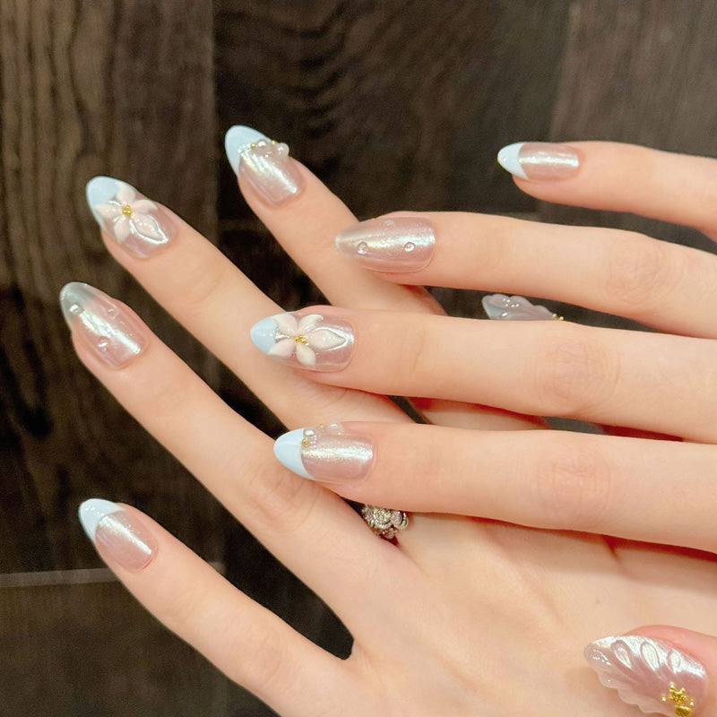 Premium almond nails for spring charm - 3D floral design, elegant pearls, soft blue French, luxurious gold details, perfect for spring celebrations