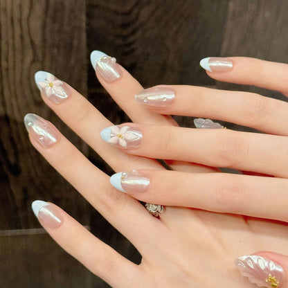Premium almond nails for spring charm - 3D floral design, elegant pearls, soft blue French, luxurious gold details, perfect for spring celebrations