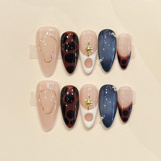 Premium almond press-on nails for mystical elegance - gold star charm, rich tortoiseshell, constellation details, perfect for celestial style
