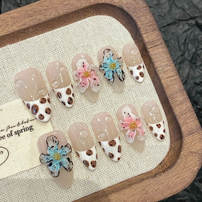 Premium almond press-on nails for spring celebrations - whimsical floral & cow print design, comfortable fit, salon-quality results