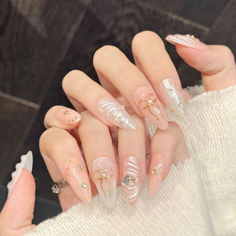Premium celestial almond nails with 3D bows & iridescent details - Reusable, damage-free luxury - Professional results