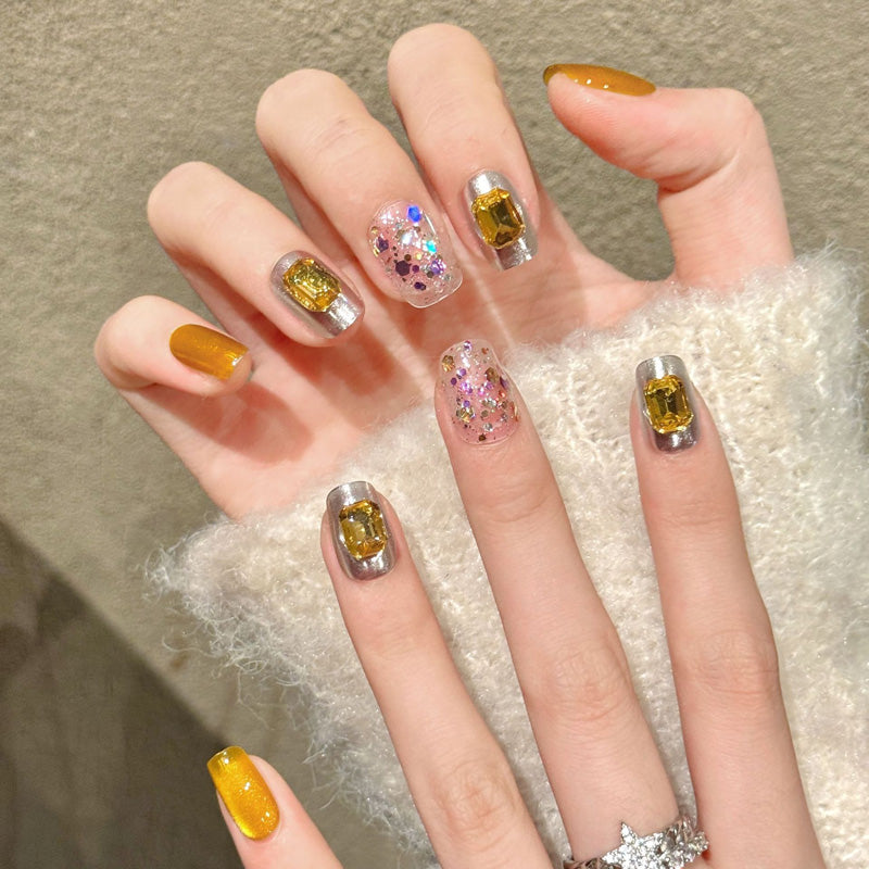 Premium coffin nails for glamorous elegance - sunny yellow citrine, large golden crystals, metallic chrome, pink-purple-gold glitter, perfect for luxury celebrations
