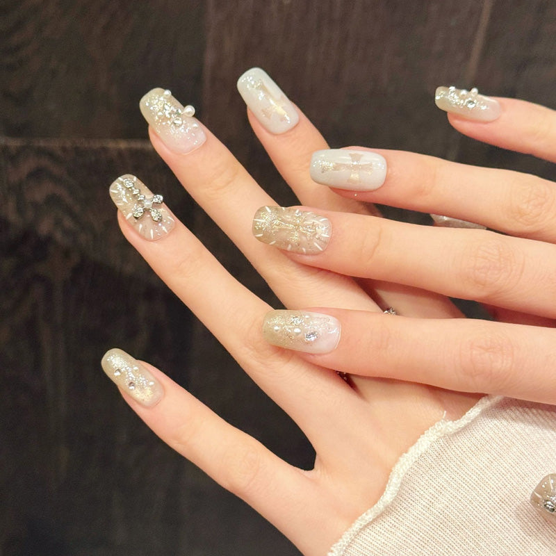 Premium coffin nails for spiritual elegance - silver rhinestone cross, angel wing accents, luxurious glitter, jelly base, perfect for religious ceremonies