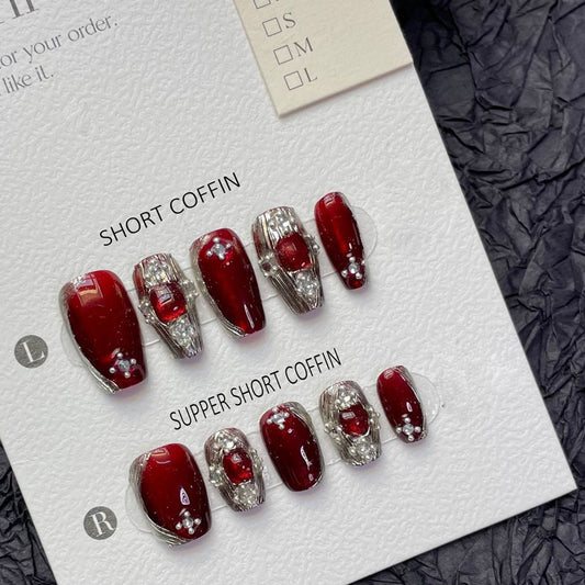 Premium handmade coffin short press-on nails with ruby red design, metallic silver accents & sparkling rhinestone details