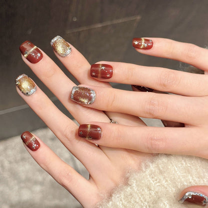 Premium holiday squoval nails with burgundy-gold ombre, silver glitter & star accents - Damage-free, reusable luxury - Festive beauty