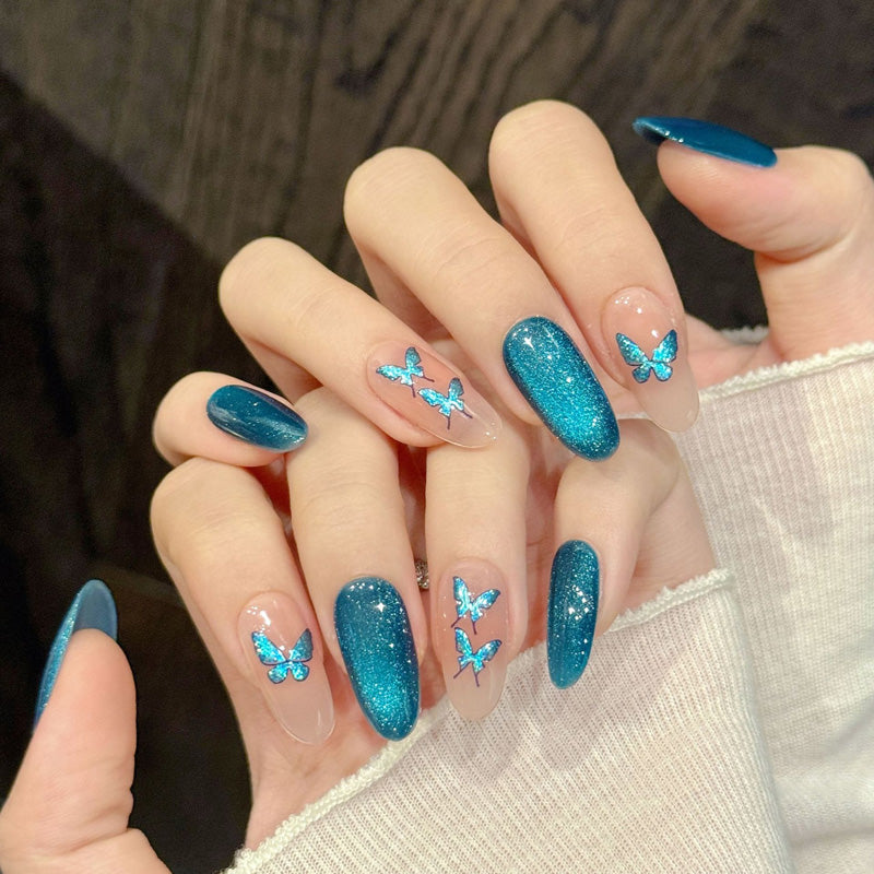 Premium oval nails for butterfly charm - delicate teal butterflies, sparkling gradient, iridescent accents, perfect for spring celebrations