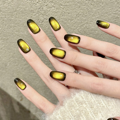 Premium oval nails for dramatic impact - yellow-black gradient, shimmer particles, ultra-gloss mirror finish, smooth transitions, perfect for edgy celebrations