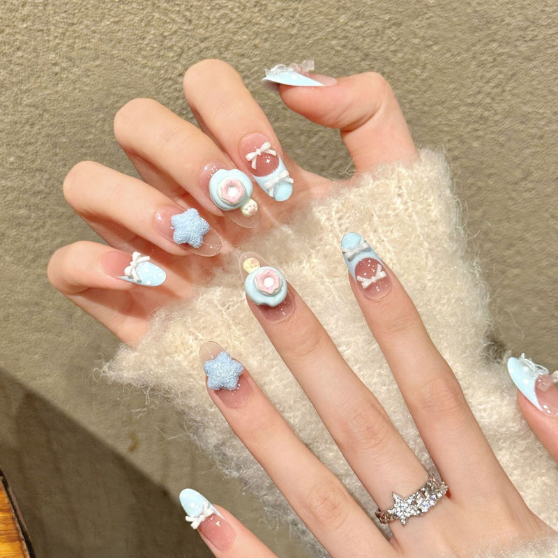 Premium oval nails for kawaii charm - 3D blue flower, textured star, sweet bow, blue-pink ombre, jelly base, perfect for dreamy celebrations
