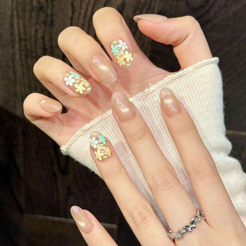 Premium oval nails for spring elegance - 3D floral art, nude-beige base, yellow-white-mint-peach flowers, gold accents, perfect for garden celebrations