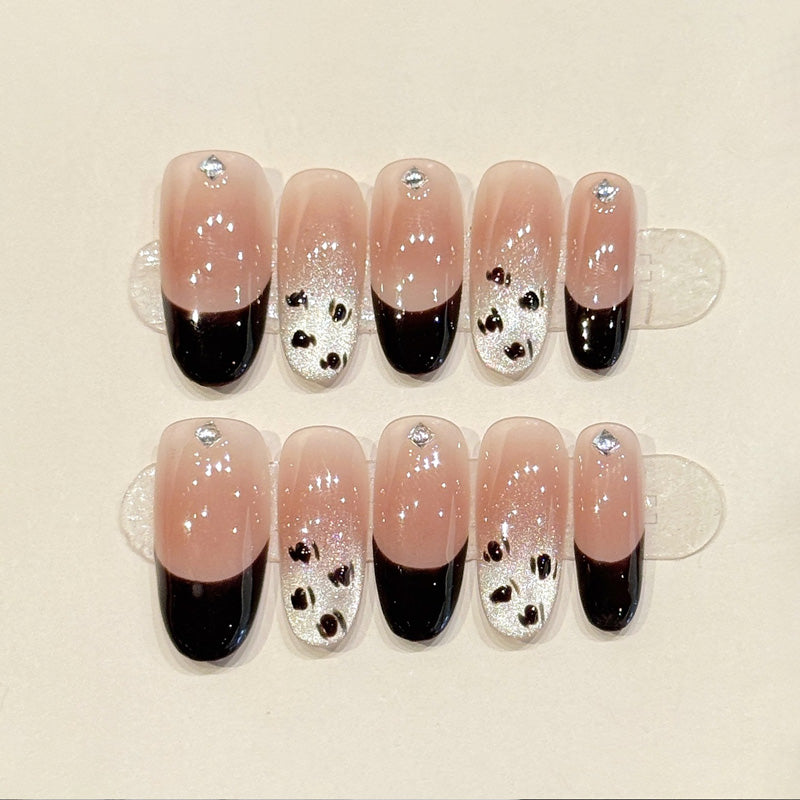 Premium oval nails for timeless charm - modern black French tips, sparkling silver glitter, elegant crystals, perfect for sophisticated celebrations"