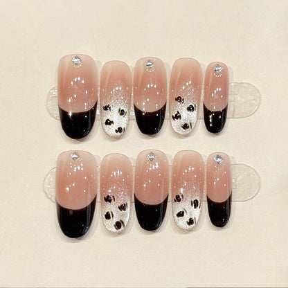 Premium oval nails for timeless charm - modern black French tips, sparkling silver glitter, elegant crystals, perfect for sophisticated celebrations"