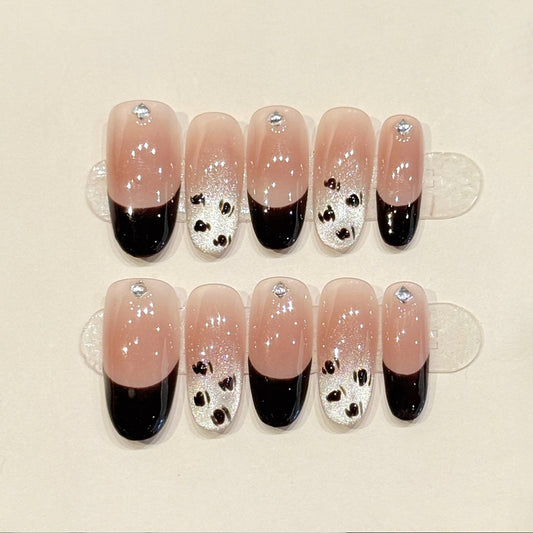 Premium oval nails for timeless charm - modern black French tips, sparkling silver glitter, elegant crystals, perfect for sophisticated celebrations"