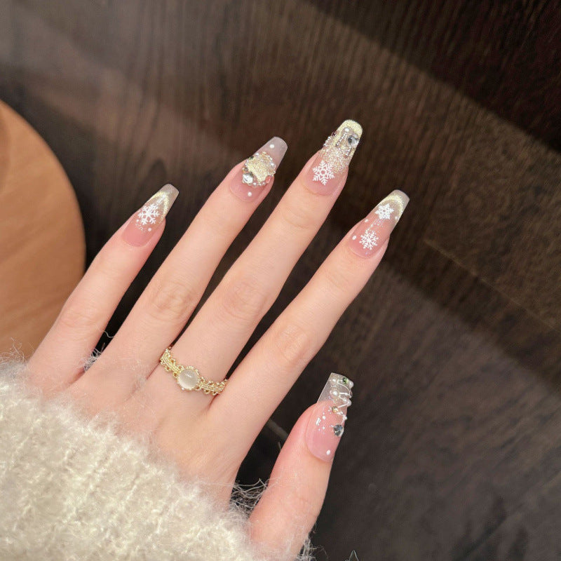 Premium oval short press-on nails for Christmas magic - white snowflakes, shimmering gold, crystal accents, perfect for holiday parties