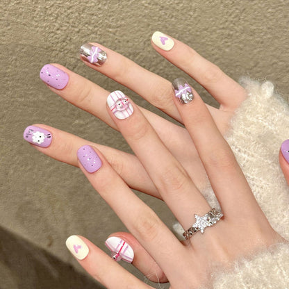 Premium squoval nails for kawaii charm - adorable bunny & bear characters, purple-pink stripes, heart accents, cute text, perfect for playful celebrations
