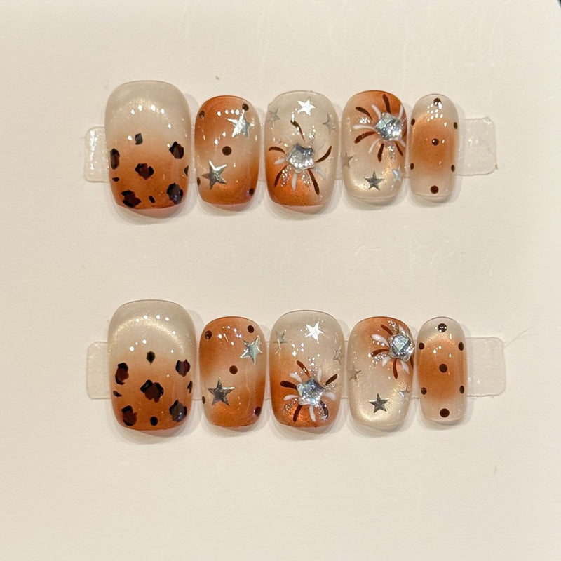 Premium squoval short nails for bold charm - playful leopard print, sparkling stars, mystical moon, warm brown gradient, perfect for wild celebrations