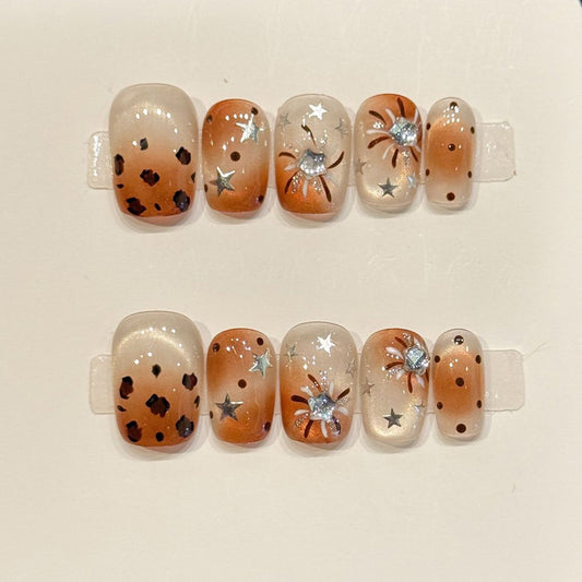Premium squoval short nails for bold charm - playful leopard print, sparkling stars, mystical moon, warm brown gradient, perfect for wild celebrations