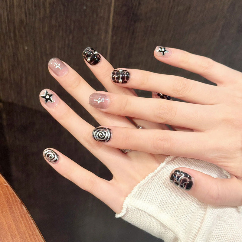Premium squoval short nails for gothic style - silver spider web, spiral patterns, black star accents, perfect for Halloween & mystical celebrations