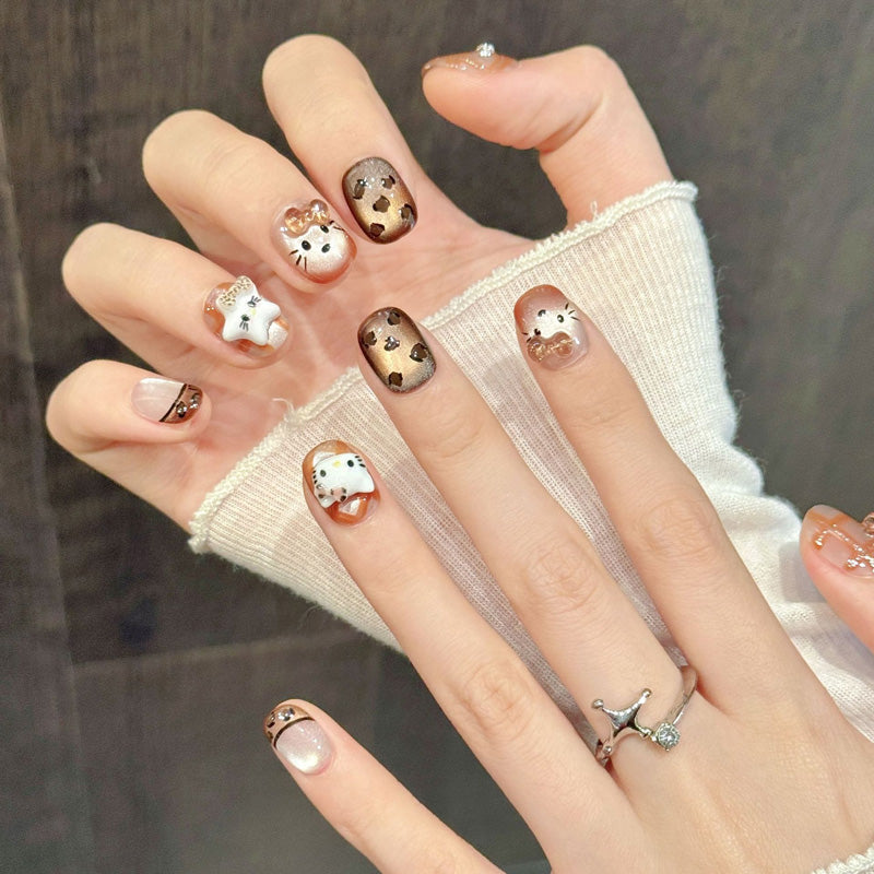Premium squoval short nails for kawaii fun - Hello Kitty faces, adorable bears, playful leopard, crystal bows, perfect for cute celebrations