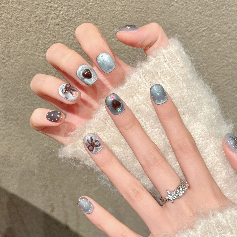 Premium squoval short nails for sweet elegance - 3D bow accents, glossy hearts, jelly base, holographic stars, perfect for romantic celebrations