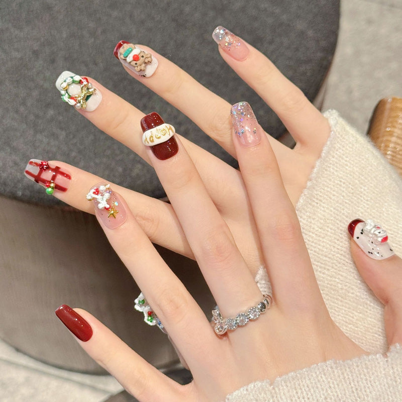 Premium squoval short press-on nails for Christmas fun - adorable 3D characters, candy cane stripes, sparkling glitter, perfect for festive gatherings