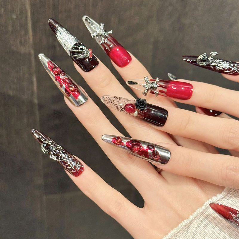 Premium stiletto long nails for gothic style - 3D black rose, silver skull charm, sparkling shimmer, burgundy-red, perfect for rock concerts & bold events