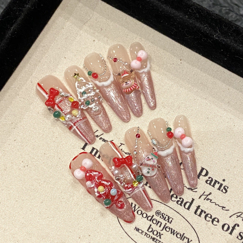 Premium stiletto long press-on nails for Christmas opulence - elegant ribbon bows, festive jewels, gold foil, perfect for luxury celebrations