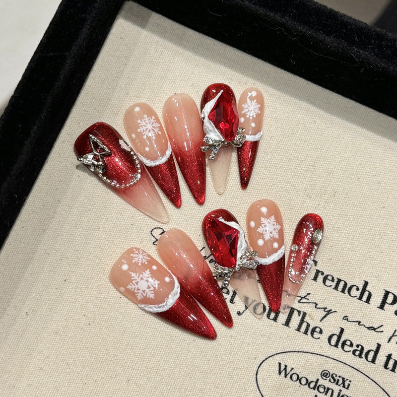Premium stiletto long press-on nails for holiday elegance - dramatic red glitter, delicate snowflakes, statement ruby, perfect for festive celebrations