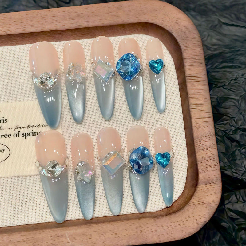 Premium stiletto long press-on nails for winter royalty - silver chrome mirror finish, sparkling blue crystals, perfect for glamorous celebrations
