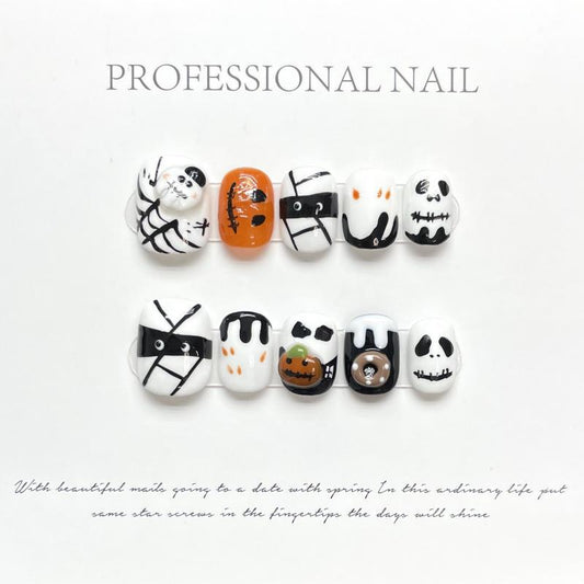 Professional Halloween character oval short press-on nails with cute ghosts, playful pumpkins, and elegant cross designs for sophisticated style