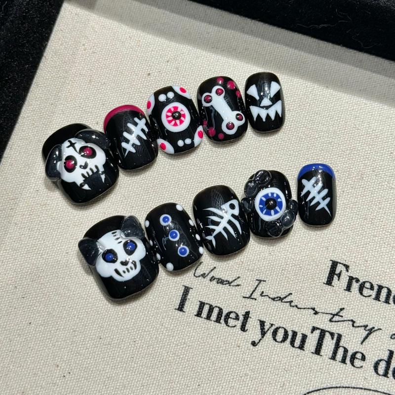 Professional quality Halloween press-on nails with skull eye theme, oval short design, complete with application kit and maintenance guide