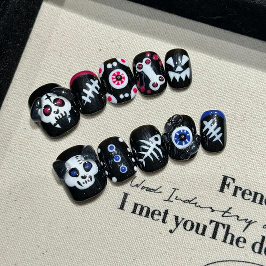 Professional quality Halloween press-on nails with skull eye theme, oval short design, complete with application kit and maintenance guide