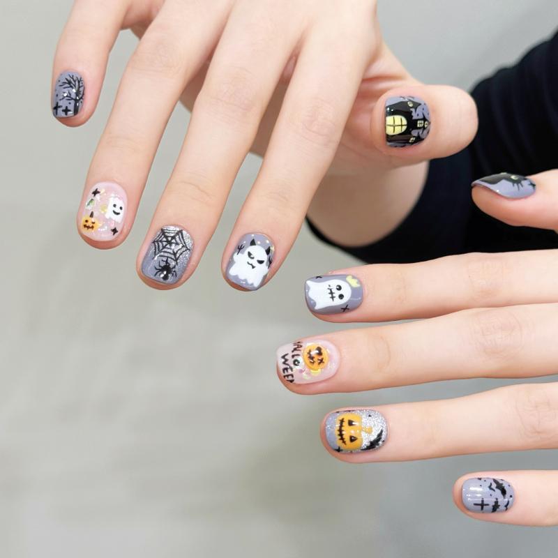 Professional quality Halloween press-on nails with spooky character theme, oval short design, complete with application kit and guide